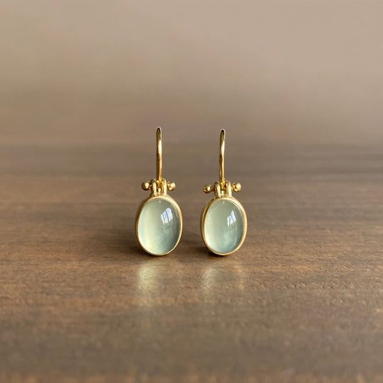 Elegant vintage earrings with radiant green moonstone