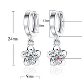 Sterling silver earrings with purple and white zirconia