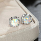 Elegant silver earrings with round white fire opals