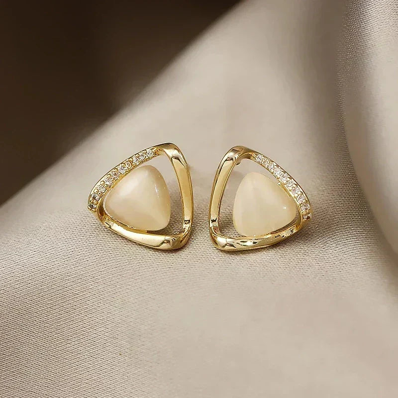Elegant triangular earrings with opal and crystals