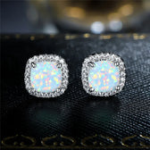 Elegant silver earrings with round white fire opals