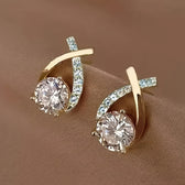 Earrings with golden cross and zirconia